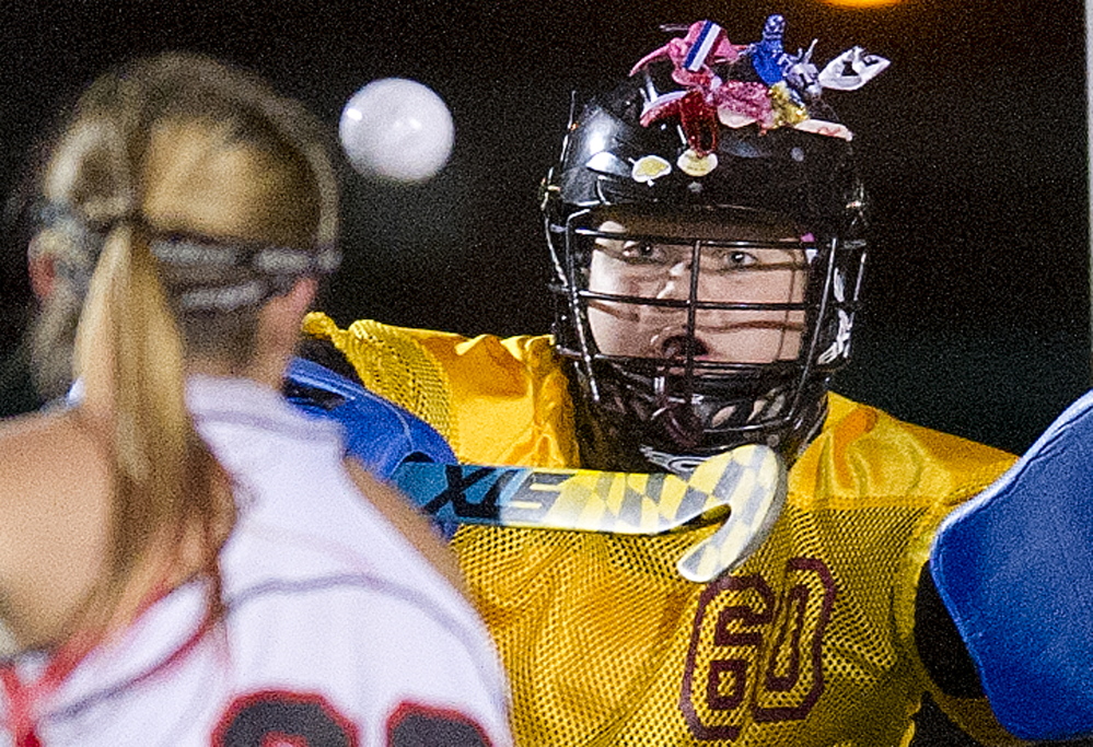 SCARBOROUGH, ME - OCTOBER 27: Thornton Academy goalie Isabella Capozzi keeps her eye on the ball as she defends her goal against incoming Scarborough attackerKristen Levesque during field hockey semifinals Tuesday, October 27, 2014. (Photo by Gabe Souza/Staff Photographer)