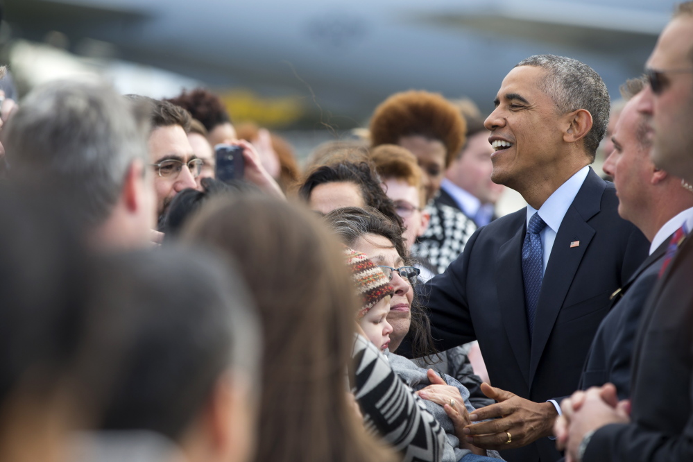 President Obama greets people in Milwaukee on Tuesday. He will also stump for candidates in Maine, Pennsylvania, Michigan, Rhode Island and Connecticut.