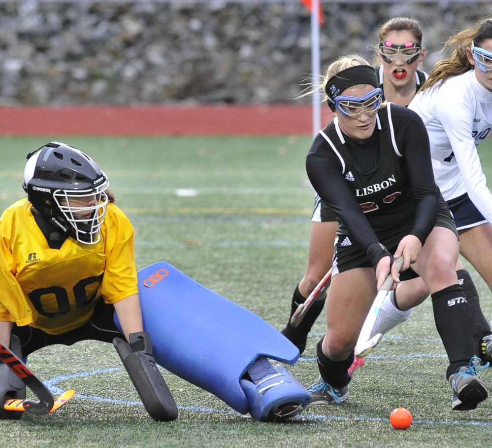 Kate Philbrick beats Yarmouth goalie Tori Messina for Lisbon’s second goal in Tuesday’s Western Class C semifinal at Yarmouth. Philbrick picked up a rebound to score the goal.