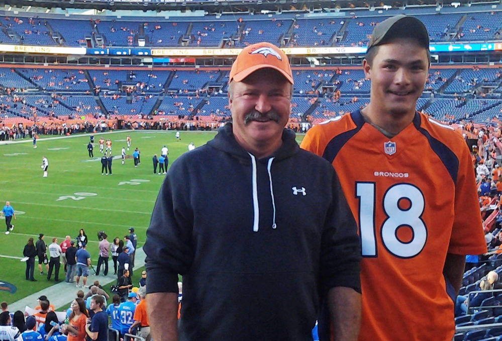 Paul Kitterman, left, seen with his stepson Jarod Tonneson, disappeared at halftime of this Oct. 23 game at Denver.