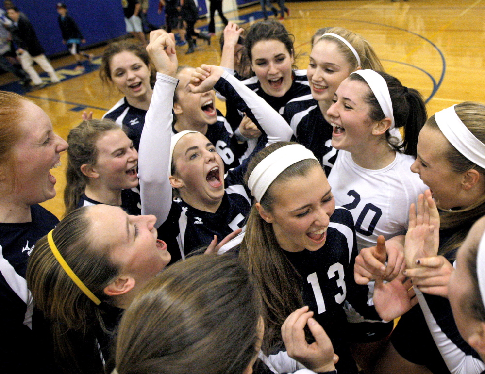 Yarmouth celebrates its 3-0 volleyball victory over Woodland in the Class B semifinals Wednesday at Yarmouth. The Clippers advanced to Saturday’s state title match in Ellsworth by winning 25-13, 25-9, 25-20.