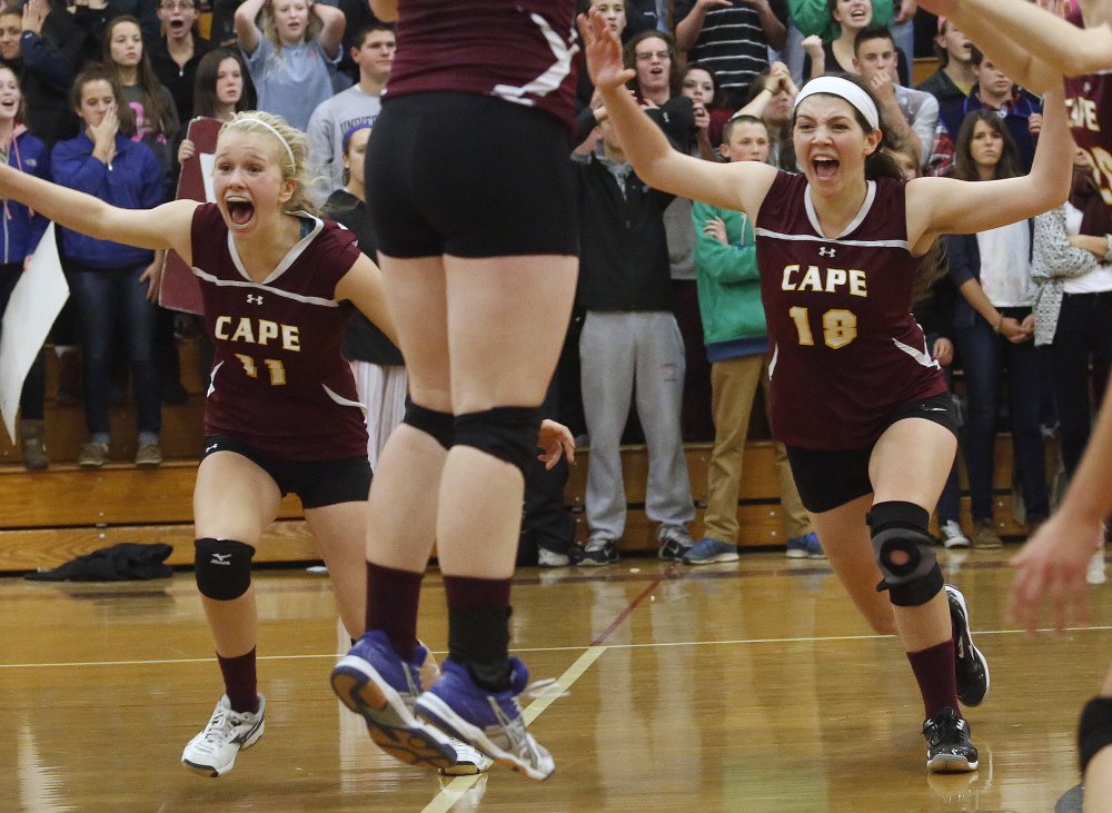 With the big comeback over, it’s time to celebrate for the Cape Elizabeth volleyball team. Katie Connelly and Monica Dell’Aquila rush the bench after the Capers beat Greely 3-2 in the Class A semifinals on Wednesday. Cape lost the first two sets before winning the final three.