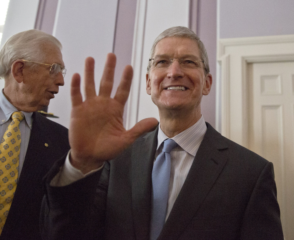 Apple CEO and Alabama native Tim Cook waves before he is honored by the Alabama Academy of Honor at the Capitol on Monday, in Montgomery.