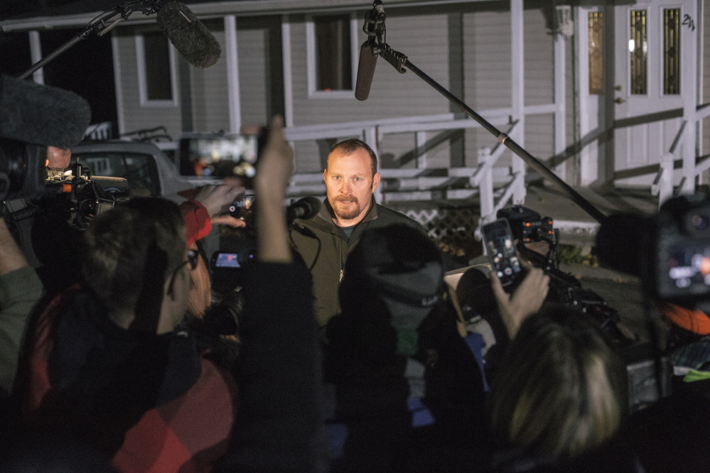 Kaci Hickox’s boyfriend Ted Wilbur talks to media members outside his Fort Kent home Thursday. He declined to discuss the legal dispute between Hickox and state officials, said she wouldn’t be saying anything else that day, and suggested that reporters go get some dinner.
