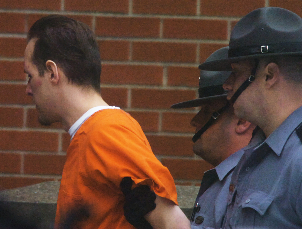 Suspected killer Eric Frein is led into the Pike County Courthouse by Pennsylvania State Troopers for his preliminary hearing on Friday.