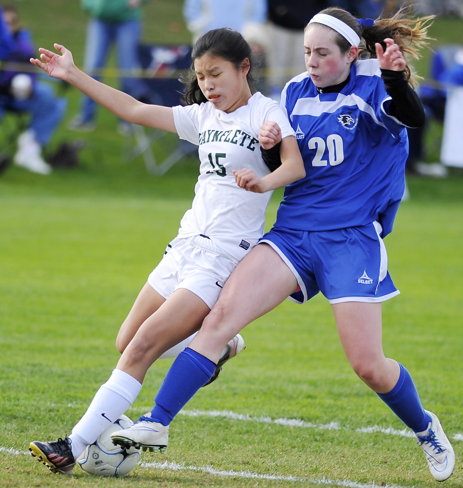 Waynflete Molly McNutt, left, fights for possession with  Abby Hughes of Sacopee Valley. Sacopee Valley will play for the regional championship on Wednesday at Maranaoook.