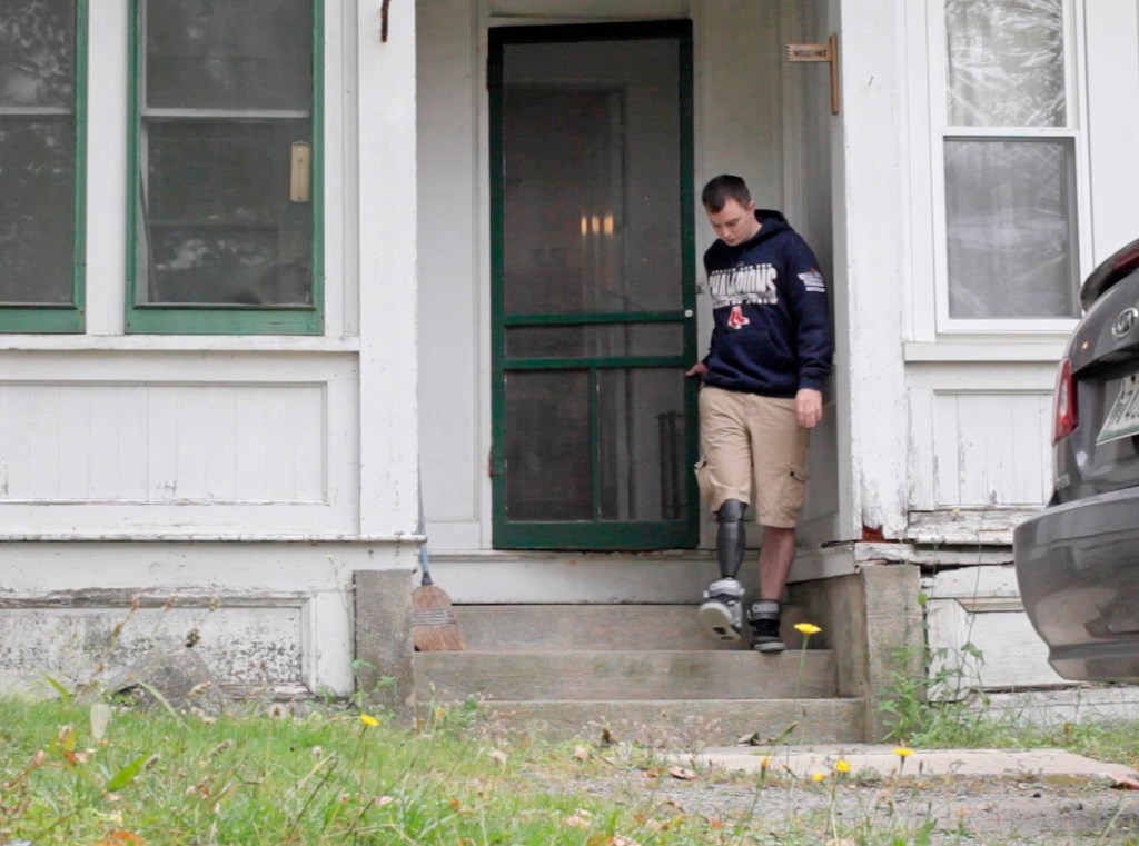 Just five months after losing his leg in a motorcycle accident, Tim Niles uses a prosthetic leg to walk out of his parents’ house and down some steps in Old Town. He plans to play sports again.
Amelia Kunhardt/Staff Photographer