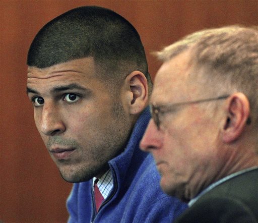 Former New England Patriots football player Aaron Hernandez, left, and his lawyer Charles Rankin attend an evidentiary hearing at Fall River Superior Court in Fall River, Mass., on Oct. 1 2014. The Associated Press / The Boston Globe