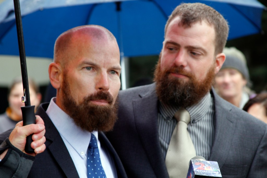 This oct. 10, 2014, file photo shows Matthew Hamby, left, and Christopher Shelden speaking during a news conference following a hearing in federal court in Anchorage, Alaska. A federal judge has struck down Alaska's first-in-the-nation ban on gay marriages. The Associated Press