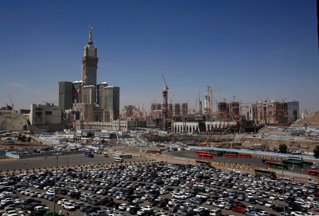 In this May 13, 2014, photo, construction cranes and scaffolding dominate the minarets and entries to the Kaaba at Mecca, Saudi Arabia. The Associated Press