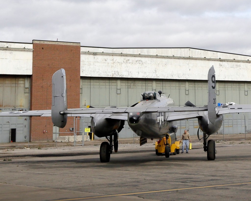 A B-25 bomber rests in front of the former Willow Run Bomber Plant in Ypsilanti Township, Mich., Thursday.The plant was where Rose Will Monroe helped build B-24 Liberator bombers during World War II. 
