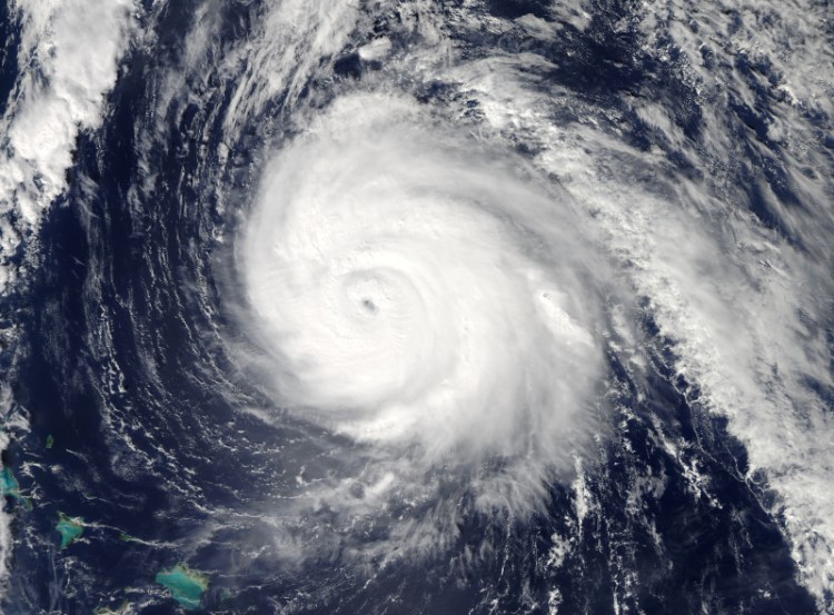 This image provided by NASA shows Hurricane Gonzalo taken at 2:45 p.m. EDT by NASA's Aqua satellite. Gonzalo was expected to pass within 29 miles (46 kilometers) of Bermuda on Friday night, close enough to be considered a direct hit, the Bermuda Weather Service warned.