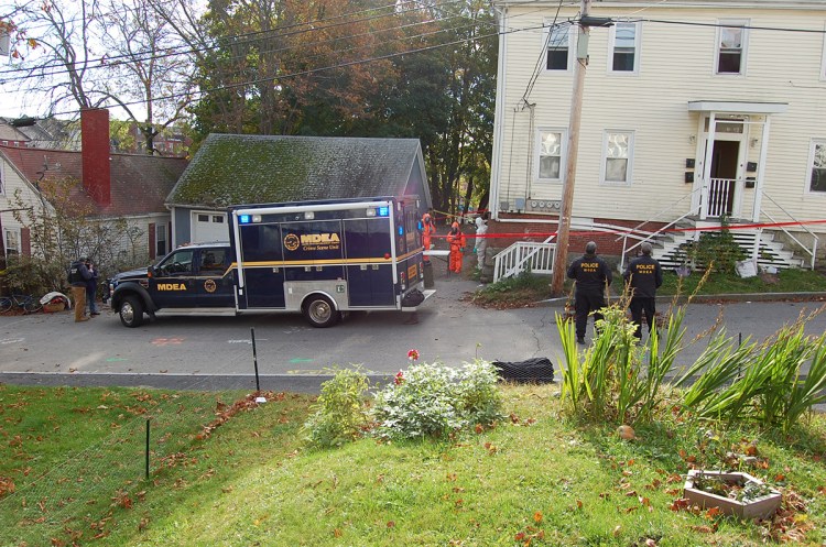 Investigators search the scene of a suspected meth lab at 50 Elm St. in Bath on Friday, October 31, 2014.