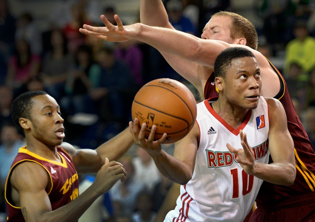 Tim Frazier of the Maine Red Claws goes between two Canton Charge defenders on his way to the basket Friday. Shawn Patrick Ouellette/Staff Photographer