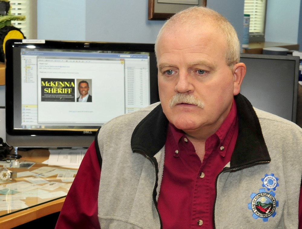 Somerset County Technical Services Director Peter Smith says the email spam that county officials received about sheriff candidate Kris McKenna, whose image is on the computer screen, cost the county time and money.