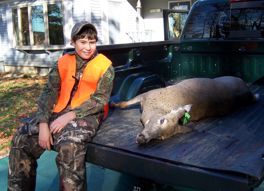 Cameron Couture, 11, of Wilton felled his first deer with one shot on Youth Deer Day. Deer season opens for Maine residents Saturday and for non-residents Monday.