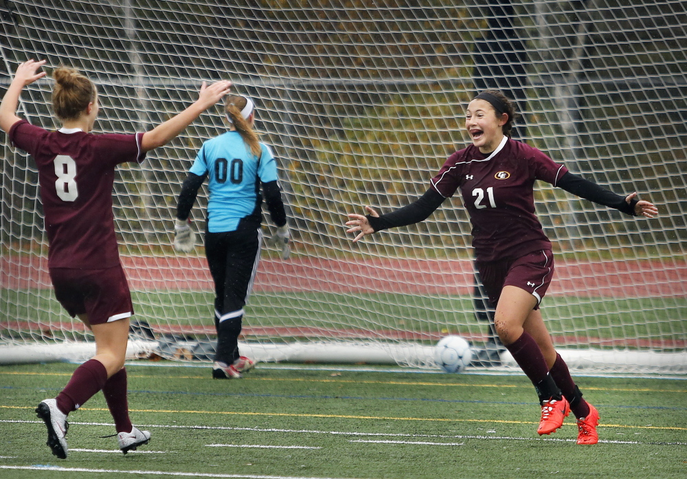 Mariah Deschino of Cape Elizabeth, right, celebrates with teammate Kate Breed after scoring in the second half as Cape Elizabeth defeated Yarmouth on Saturday 1-0 in a Western Class B semifinal.Derek Davis/Staff Photographer
