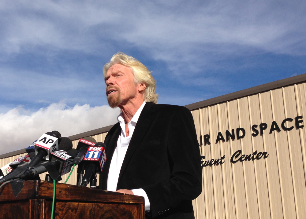 Billionaire Virgin Galactic founder Richard Branson, during a news conference in Mojave, Calif., on Saturday, salutes the bravery of test pilots, and vows to find out what caused the crash of his prototype space tourism rocket that killed one crew member and injured another. Virgin Galactic’s SpaceShipTwo blew apart about 20 miles from the Mojave airfield after being released from a carrier aircraft Friday.
