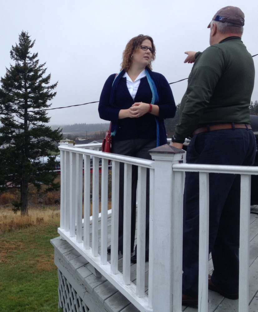 Democratic 2nd District candidate Emily Cain speaks with Bob Peacock, a harbor pilot, during a recent campaign swing through Eastport.