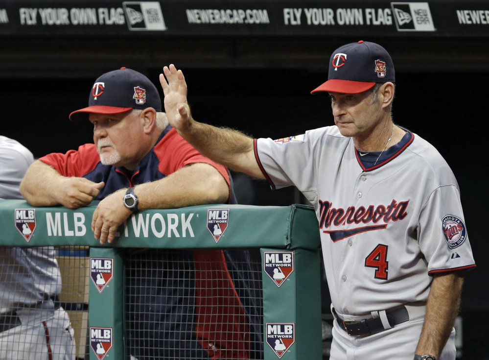 Paul Molitor (4), seen coaching the Minnesota Twins with manager Ron Gardenhire in September, will be introduced as the team’s new manager Tuesday and given a three-year contract, replacing Gardenhire.