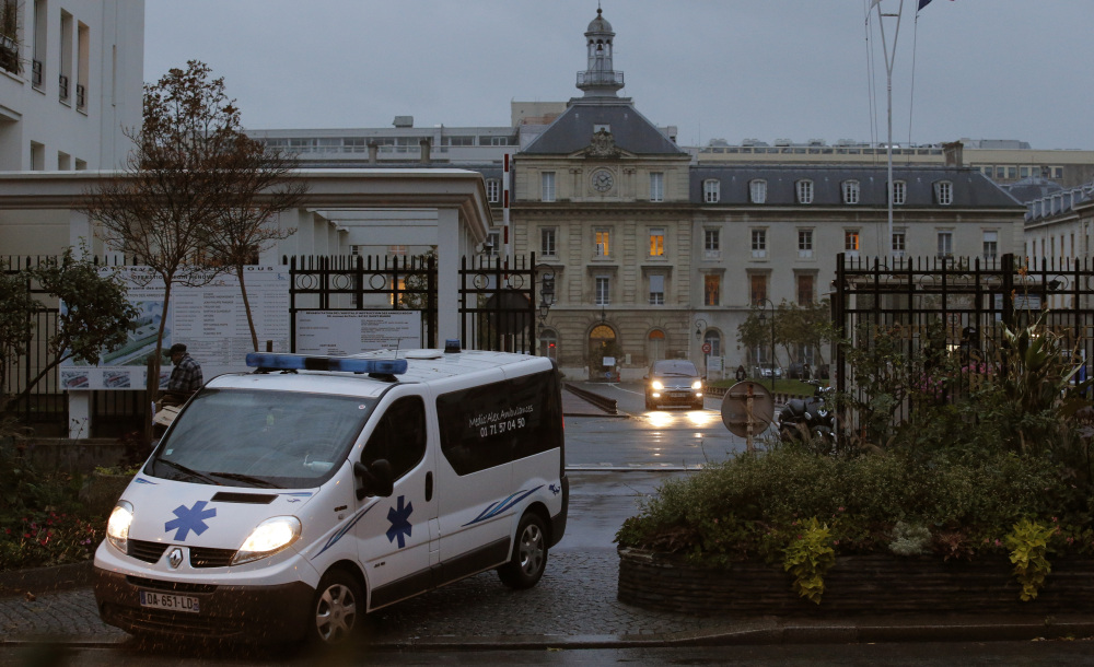 An ambulance exits the main entrance Monday of a hospital in eastern Paris, where a UNICEF employee infected with Ebola in Sierra Leone has been admitted for treatment. France’s Health Ministry said the patient was being cared for in “high-security isolation.”