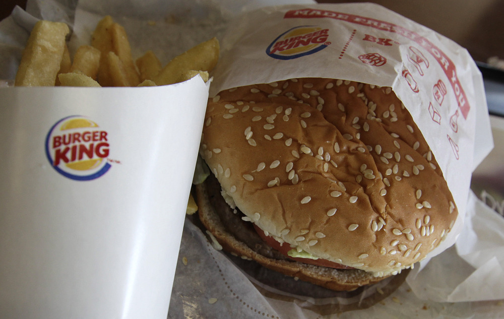 This Wednesday, June 20, 2012 photo shows a burger and fries at a Burger King in Richardson, Texas.