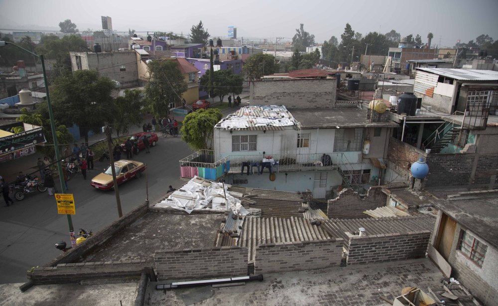 A view of one of several homes that police raided in their search for fugitive mayor of Iguala, Jose Luis Abarca, and his wife, Maria de los Angeles Pineda, in the Iztapalapa neighborhood of Mexico City on Monday.