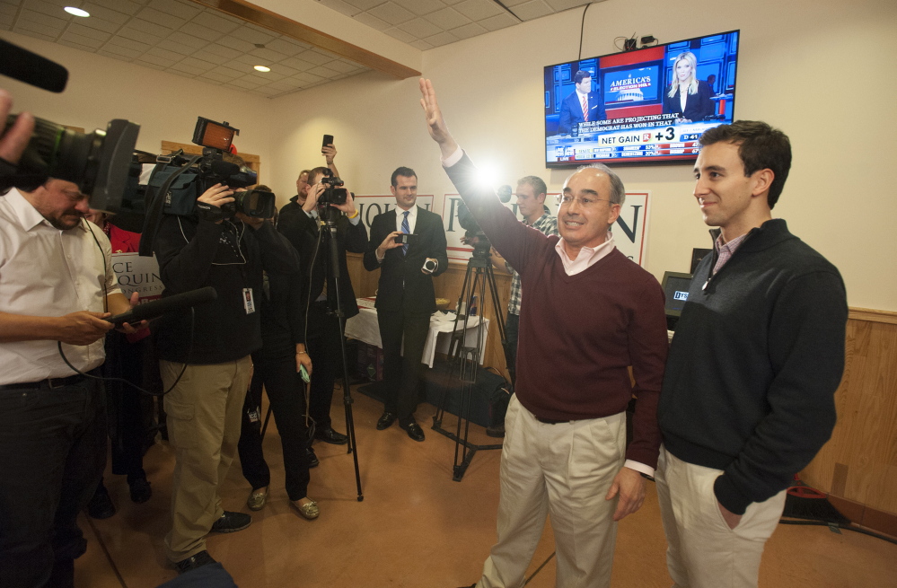 Bruce Poliquin greets his supporters at Dysart’s in Bangor, telling them the night will be a long one, he encouraged all to get food and wait for the results on Tuesday evening. At right is Poliquin’s son, Sam.