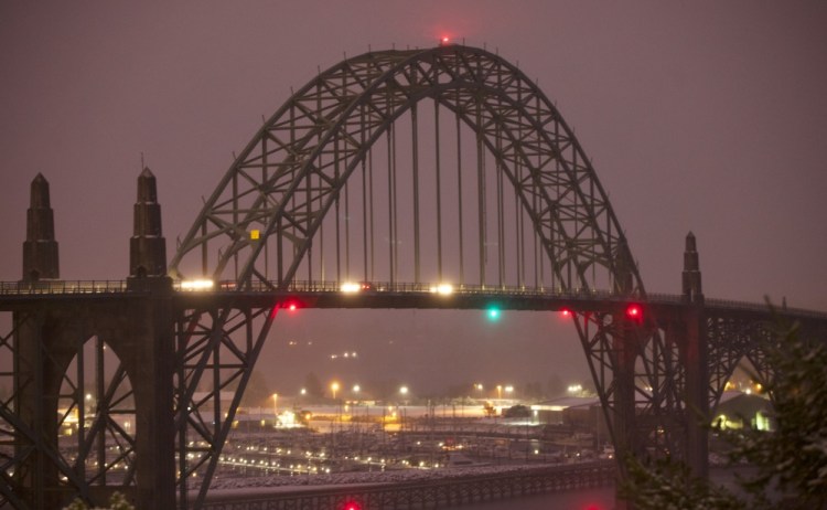 This Dec. 6, 2013 photo, shows the Yaquina Bay Bridge, Newport, Ore. A woman who appealed for money online to help care for her autistic son and disabled husband has been accused of throwing her 6-year-old boy to his death off the historic bridge on Monday.