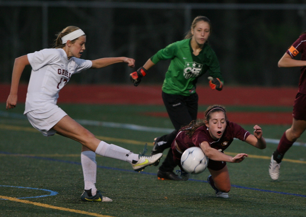Cape Elizabeth’s Morgan Wight, right, blocks Greely’s Courtney Sullivan’s shot as the goalie looks on during the second half of the Western Class B girls’ soccer final on Wednesday in Yarmouth. Cape Elizabeth won 2-1 in penalty kicks.