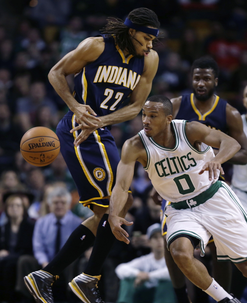 Boston Celtics guard Avery Bradley (0) steals the ball from Indiana Pacers forward Chris Copeland (22) during the second quarter in Boston on Friday.
The Associated Press