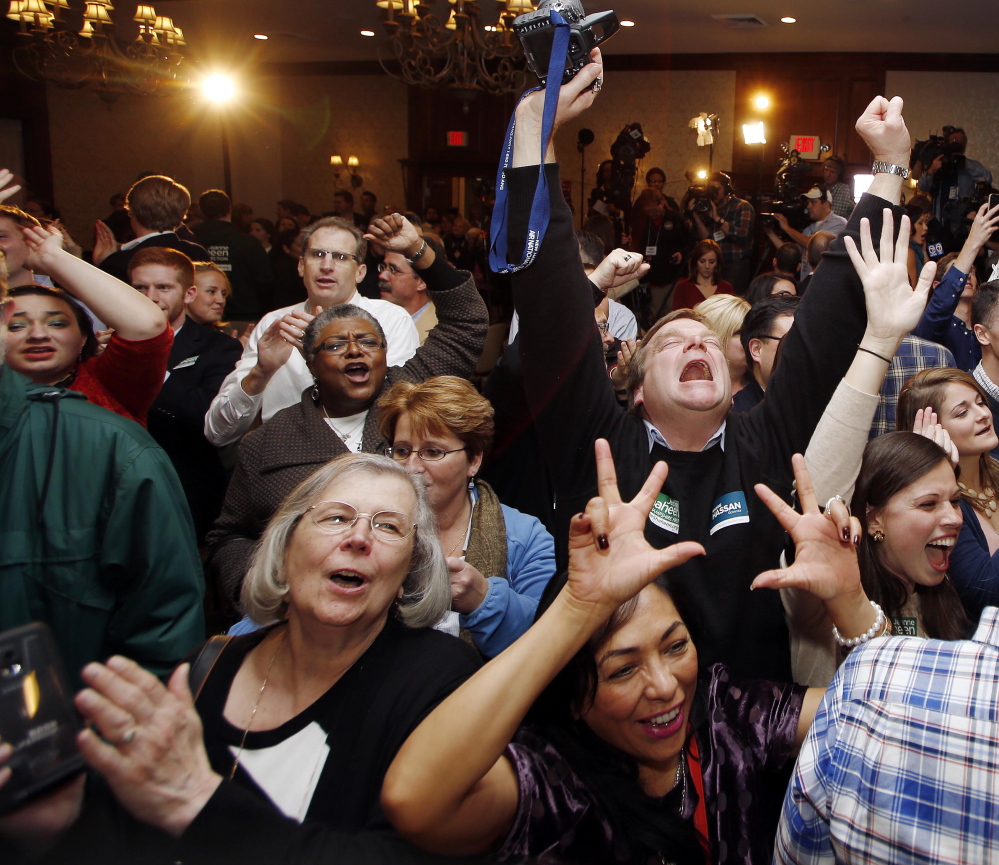 Democratic supporters cheer during Sen. Jeanne Shaheen’s victory party in Manchester, N.H., late Tuesday night, but the popular senator’s coattails weren’t long enough to carry lower-ticket candidates.