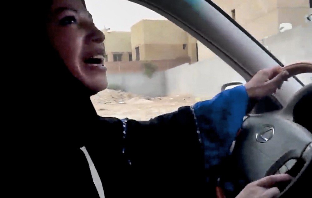 In image released by Change.org, a website used by activist groups, a Saudi Arabian woman drives a car as part of a campaign to defy Saudi Arabia's ban on the practice.