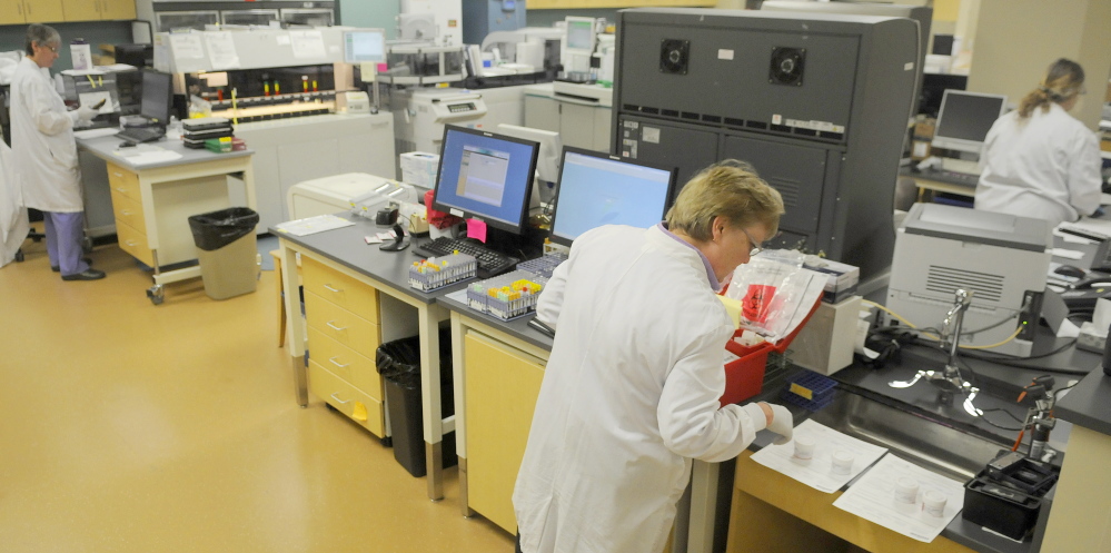 Technicians process samples recently in the laboratory at MaineGeneral.