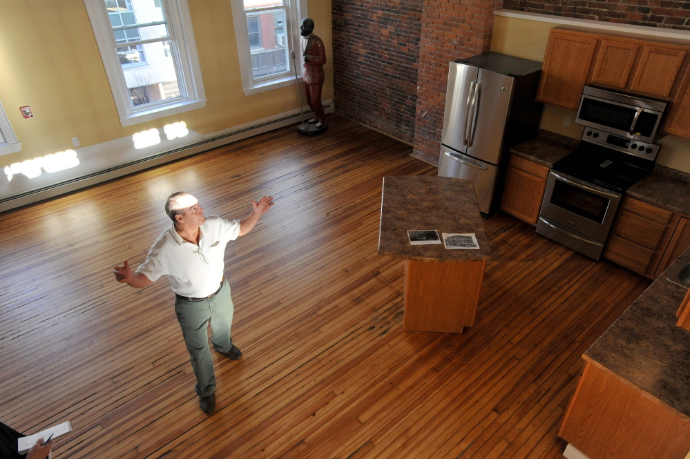 Charlie Giguere offers a tour of the penthouse apartment on the third floor of his newly renovated downtown Waterville building on Main Street. Giguere has turned upper floors of his business, Silver Street Tavern, into offices and apartments, furthering the view that upper floors downtown are good places to live and work.