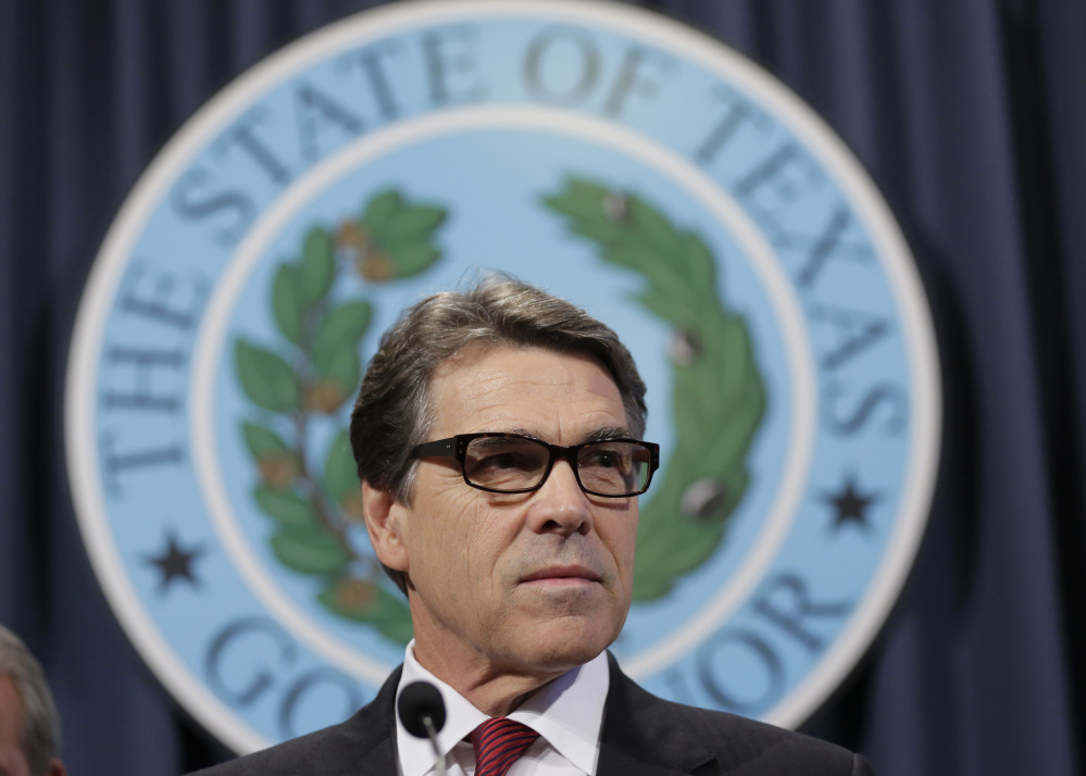 FILE - In this Oct. 17, 2014, file photo, Texas Gov. Rick Perry speaks during a news conference in Austin, Texas.