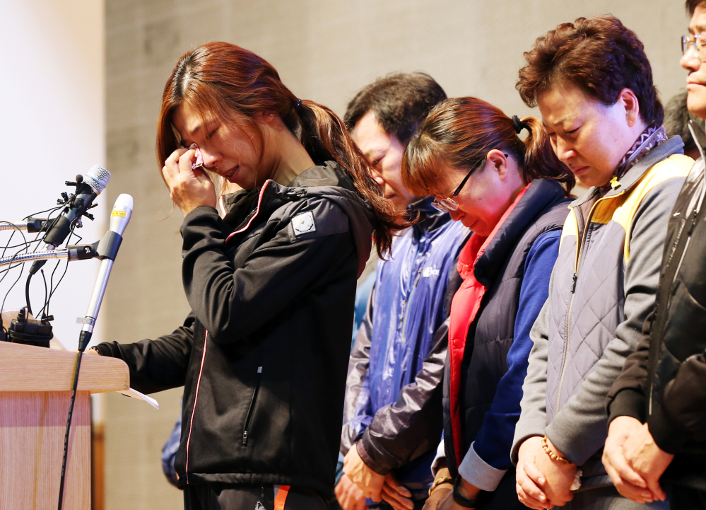 Relatives of the nine missing passengers of the sunken ferry Sewol cry during a news conference at a gym on South Korea’s southwestern island of Jindo, where they have been staying at since the April 16 sinking of ferry Sewol, in Jindo, South Korea. A South Korean court on Tuesday handed a 36-year prison sentence to the captain of a sunken ferry.