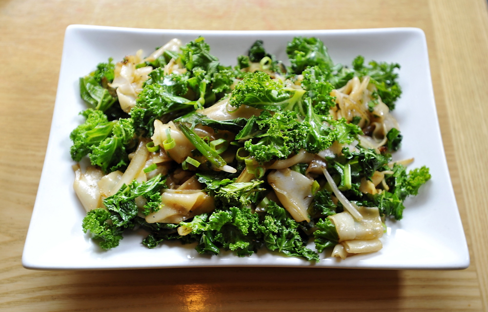 Sautéed Kale Noodles (above) are on Empire Chinese Kitchen’s menu. David’s offers a vegan pizza with leafy greens, and the Green Elephant has a raw appetizer using collards, called Green Leaves Wrap with Mango and Herbs.