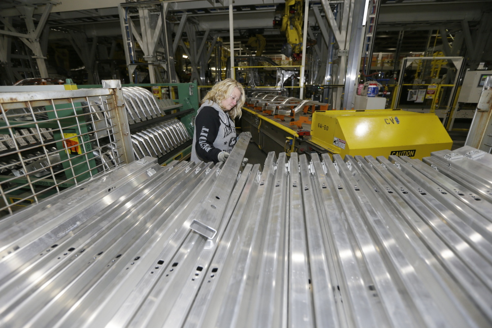 Jennifer Gillesbie works on the frame of the new Ford F-150 truck. Aluminum isn’t new to the auto industry, but this is the first time it will cover the entire body of such a high-volume vehicle.