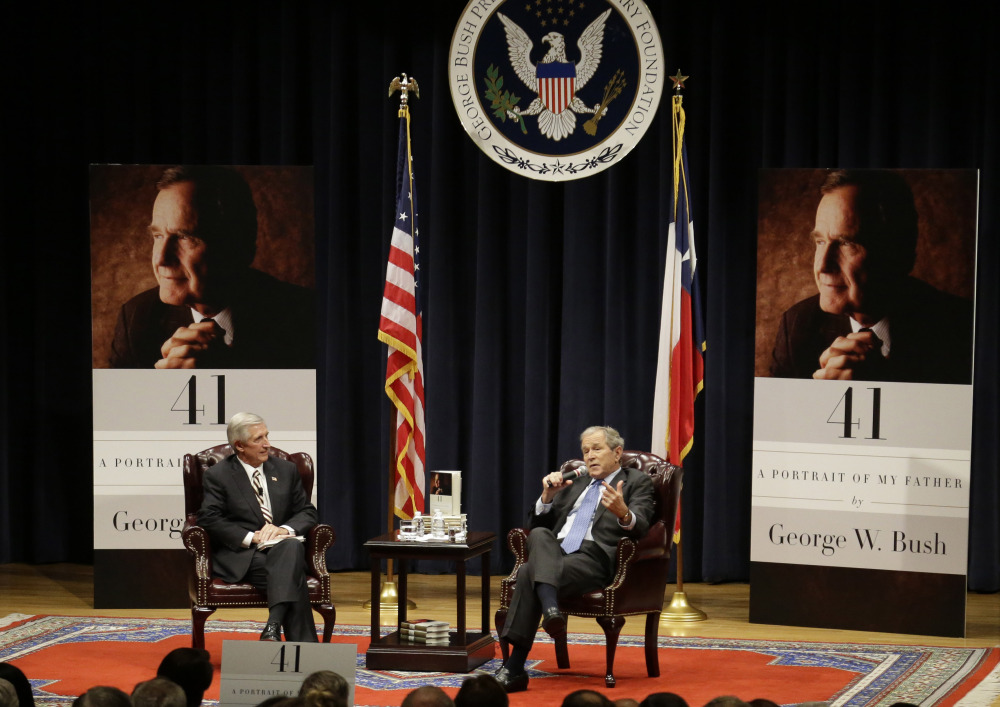Bush, right,  discusses his new book with Andrew Card, his former chief of staff.