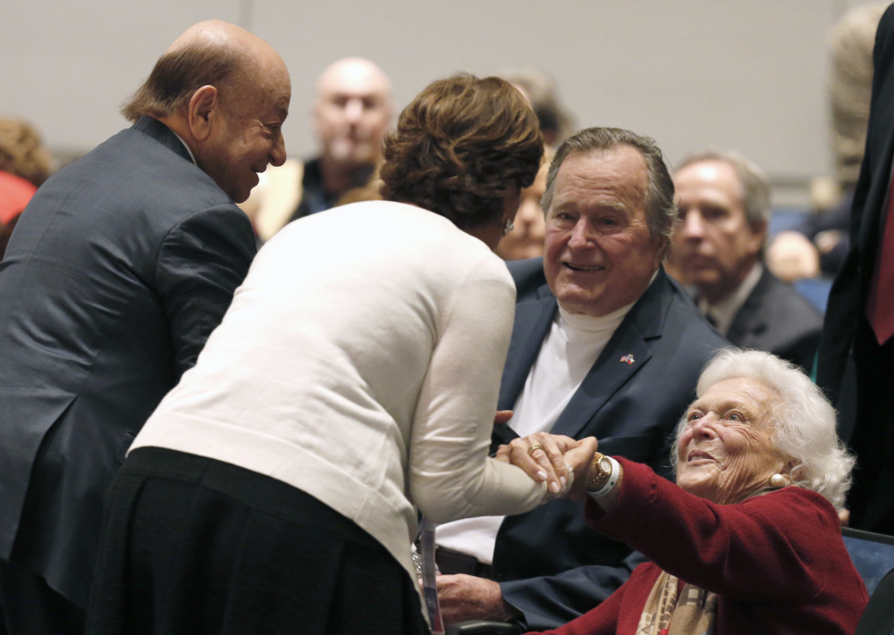 Barbara Bush, right, and former President George H.W. Bush greet friends at his presidential library before their son George W. Bush discussed his new book.