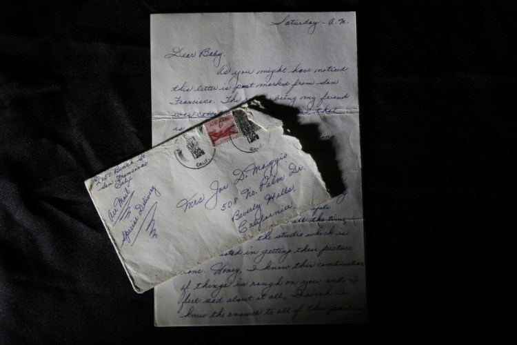 This photo shows part of a three-page handwritten letter and original envelope postmarked Oct. 9, 1954 from baseball legend Joe DiMaggio to Marilyn Monroe on display at Julien’s Auctions in Beverly Hills, Calif.