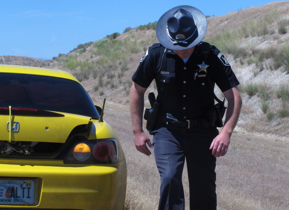 Two California men have filed a federal civil rights lawsuit challenging asset-forfeiture laws after a traffic stop in Iowa. They contend it was part of a pattern connected to the teachings of a private Oklahoma-based police-training company that promotes aggressive tactics.