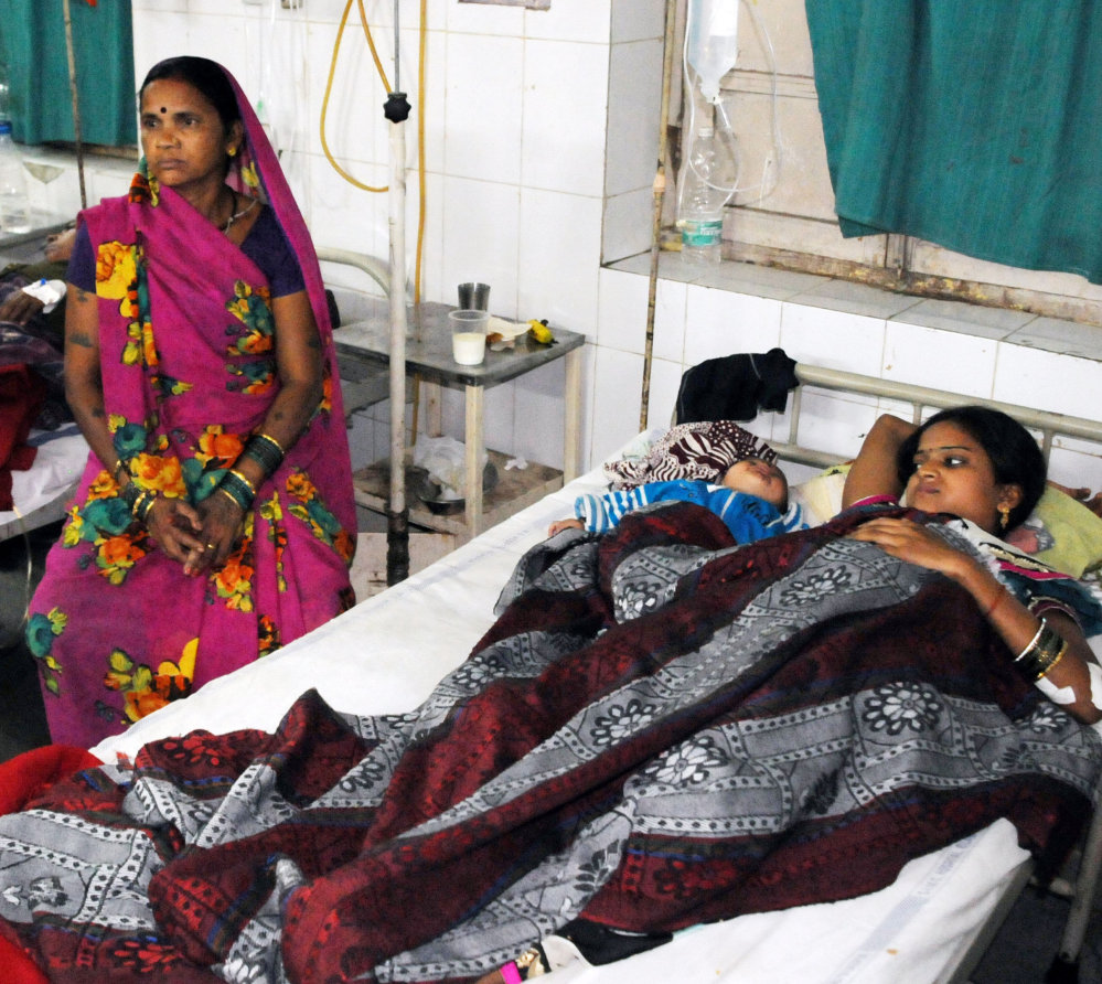 Indian women who were among the 83 who underwent sterilization surgeries receive treatment at the CIMS hospital in Bilaspur, India, on Tuesday. In addition to the 11 women who died, about 20 are seriously ill because of complications after the surgeries.