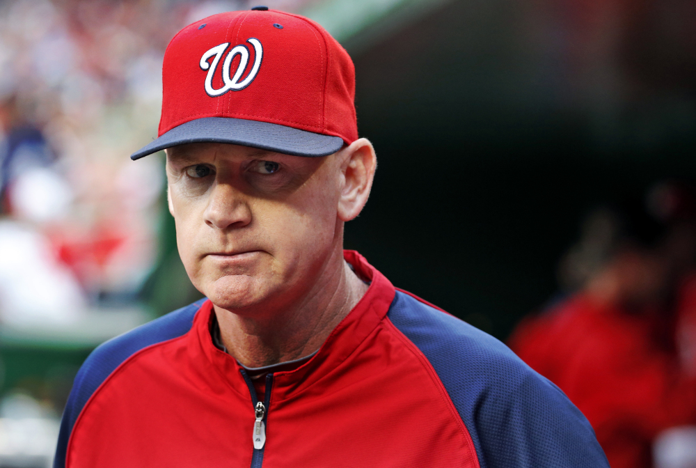 In this June 21, 2014, file photo, Washington Nationals manager Matt Williams walks in the dugout before the Nationals’ baseball game against the Atlanta Braves in Washington.