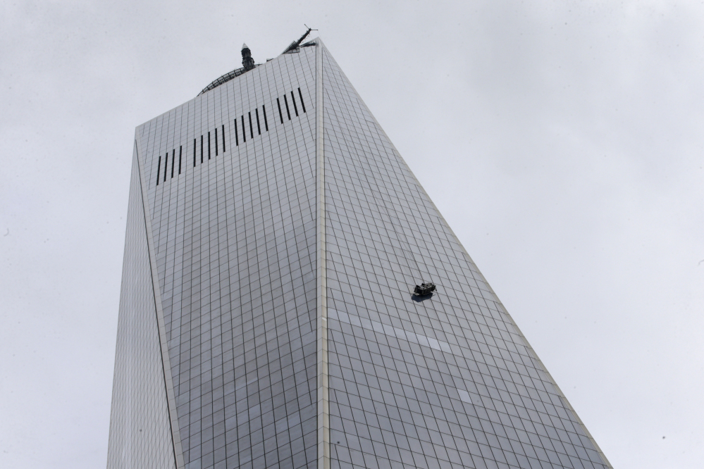 Two window washers were rescued from a partially collapsed scaffolding outside One World Trade Center in New York on Wednesday.