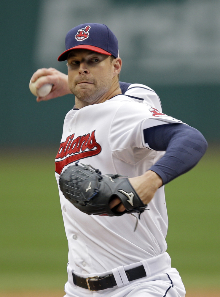 Cleveland Indians pitcher Corey Kluber, seen facing the Minnesota Twins in September, won the American League Cy Young Award, edging Seattle’s Felix Hernandez.
