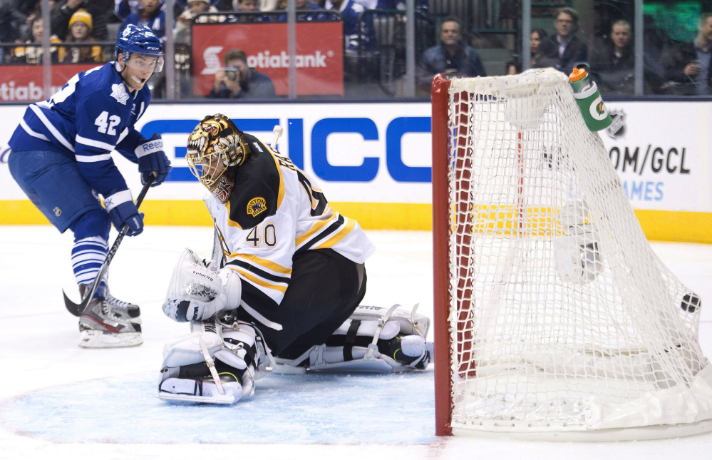 Toronto Maple Leafs forward Tyler Bozak beats Boston Bruins goalie Tuukka Rask for a goal in the second period Wednesday night in Toronto. Rask allowed four goals before being replaced in the second period.