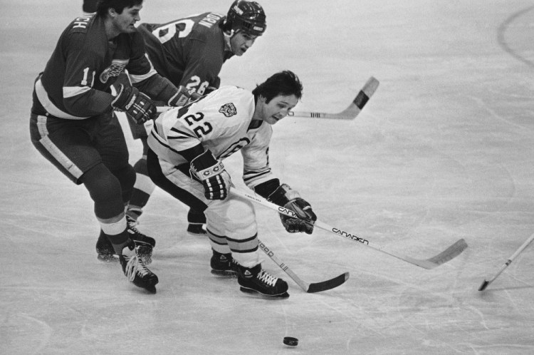 Brad Park skates for the puck as Detroit’s Peter Mahovlich (11) and Jim Korn pursue him in a game at the Boston Garden on March 13, 1980. Park, who is 66 now and has a home in Maine, last played in 1985.