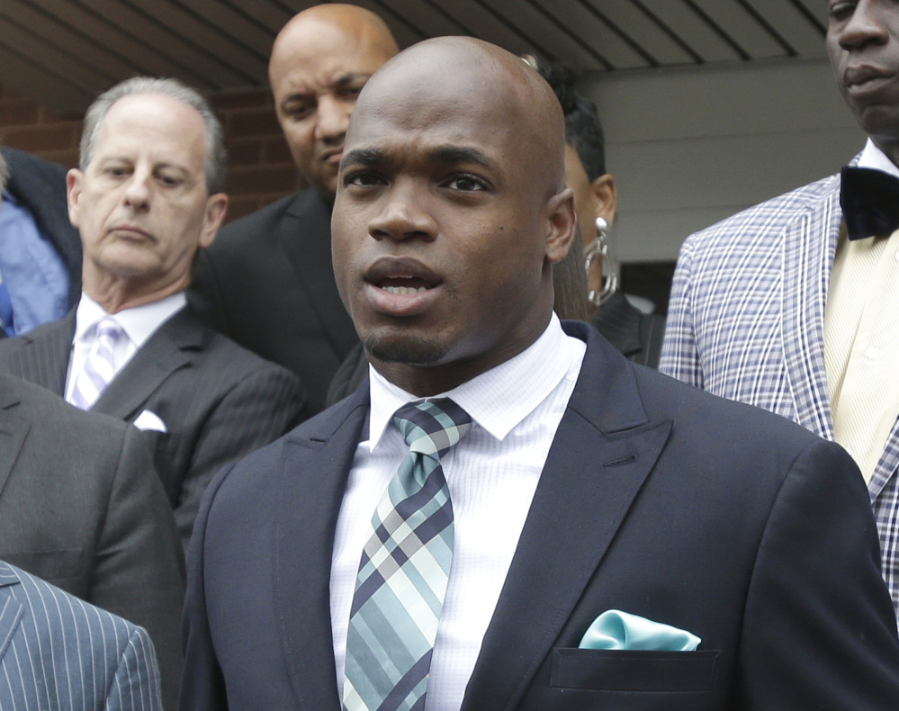 Minnesota Vikings running back Adrian Peterson speaks to the media after pleading no contest on Nov. 4 to an assault charge in Conroe, Texas. Peterson will meet with the NFL on Monday about possible reinstatement with the Vikings.